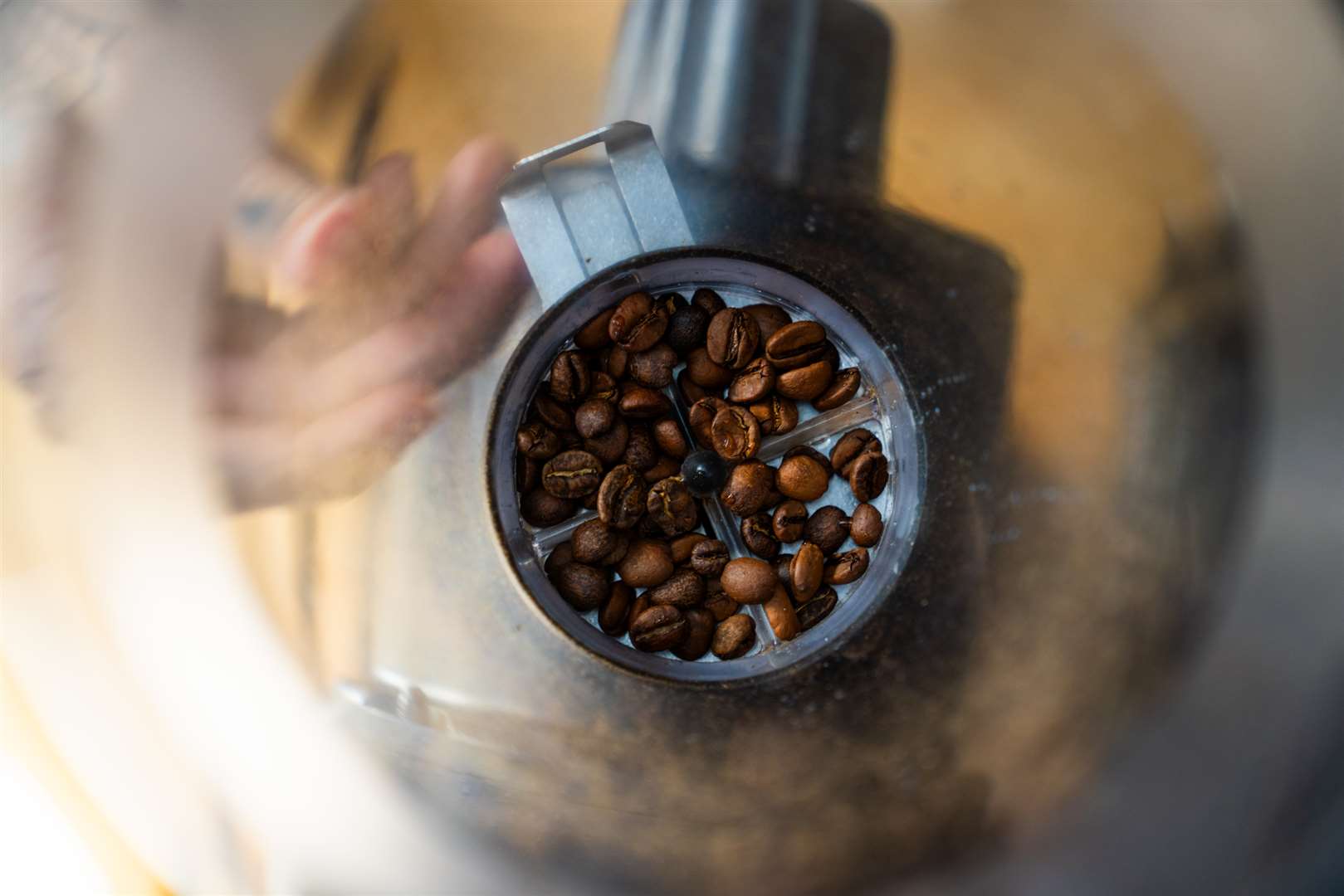 The friction of coffee beans during grinding generates electricity that causes coffee particles to clump together and stick to the grinder (University of Oregon)