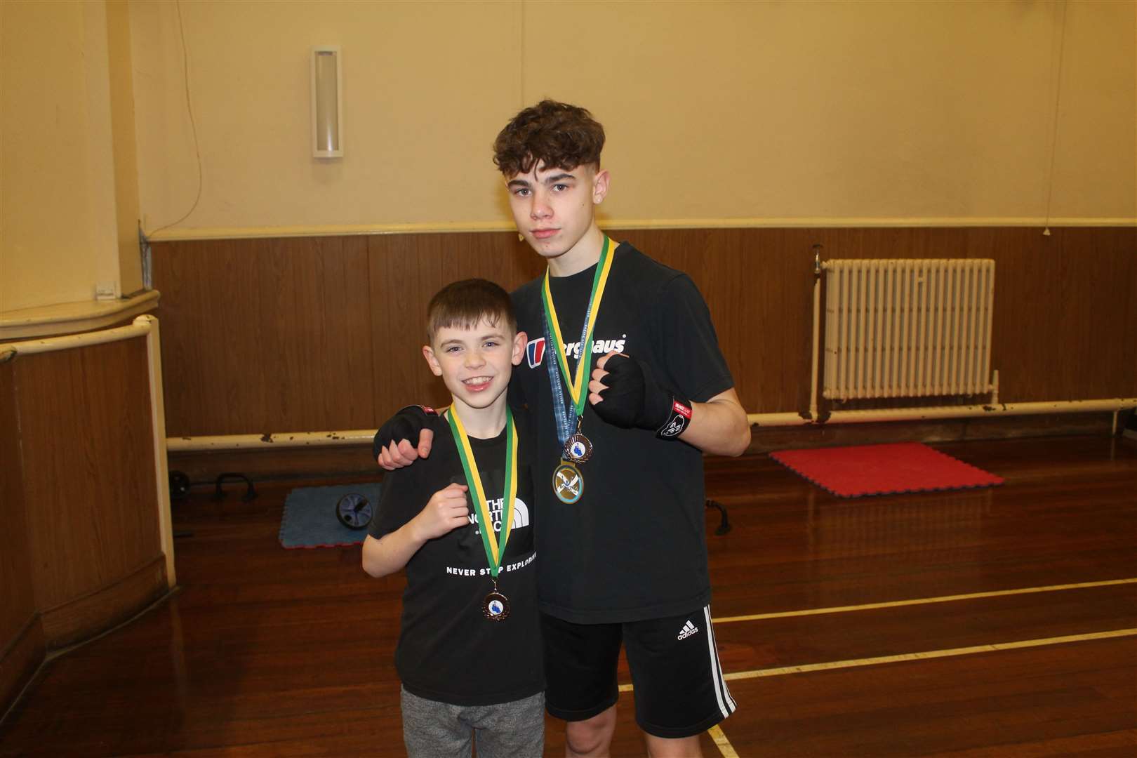 Boxer Nathaniel Cook with his younger brother Ben (10) who recently won silver at the Northern District Championship.