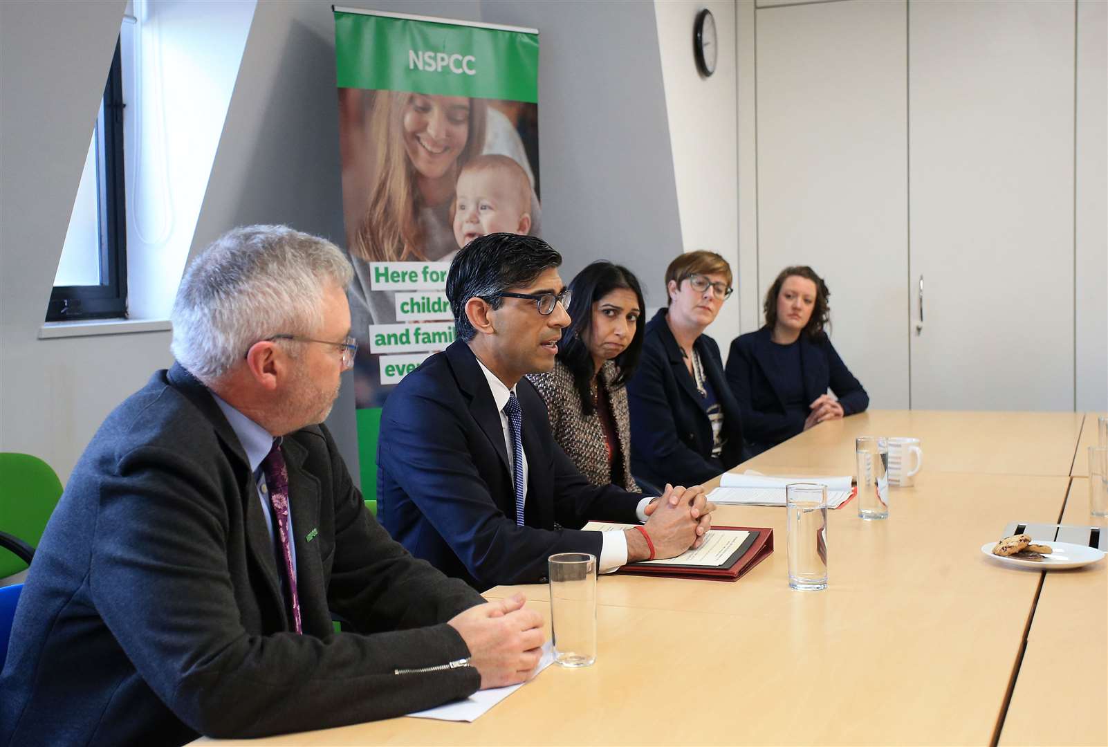 Rishi Sunak and Suella Braverman with National Society for the Prevention of Cruelty to Children chief executive Peter Wanless last month (Lindsey Parnaby/PA)