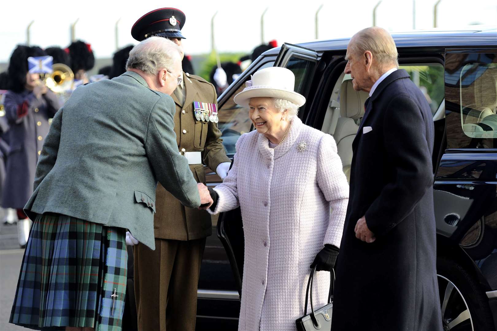 Queen Elizabeth and His Royal Highness The Duke of Edinburgh arrive at Kinloss Barracks where they are welcomed by then Vice Lord Lieutenant of Moray Jim Royan. Picture: Daniel Forsyth
