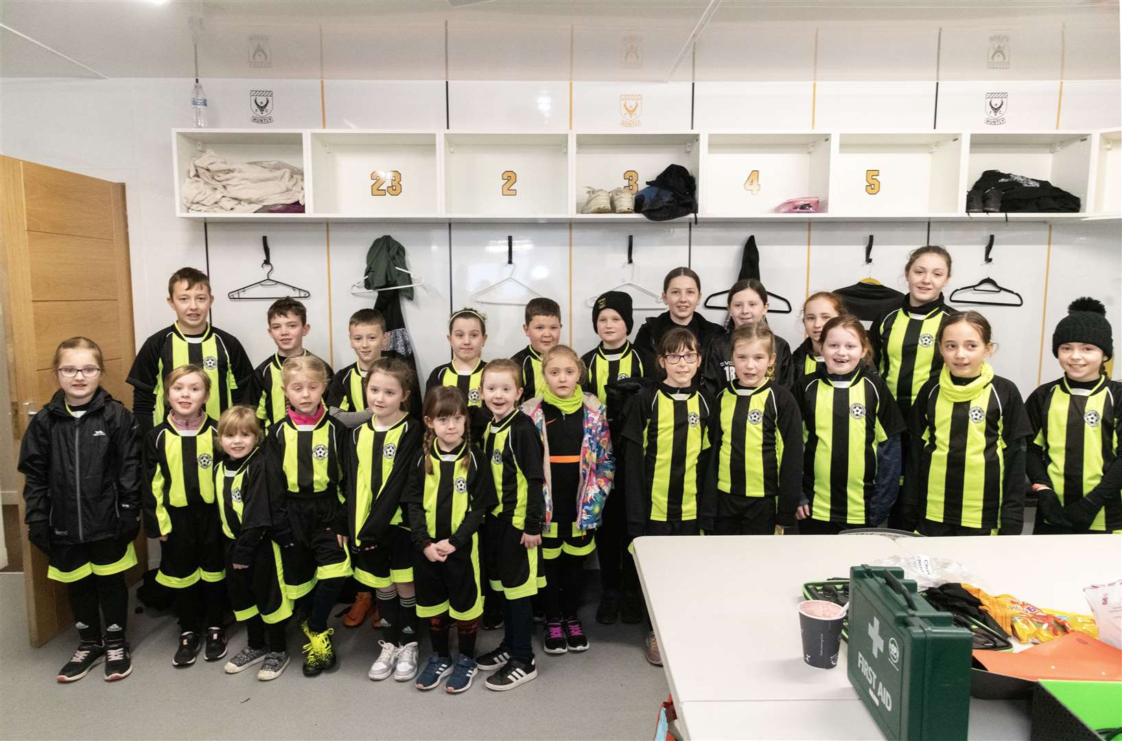 Mascots and ball boys and ball girls in the dressing room prior to the start of Huntly Women's first match...Huntly Women's F.C. v Inverurie Locos Works F.C Ladies at Christie Park...Picture: Beth Taylor.