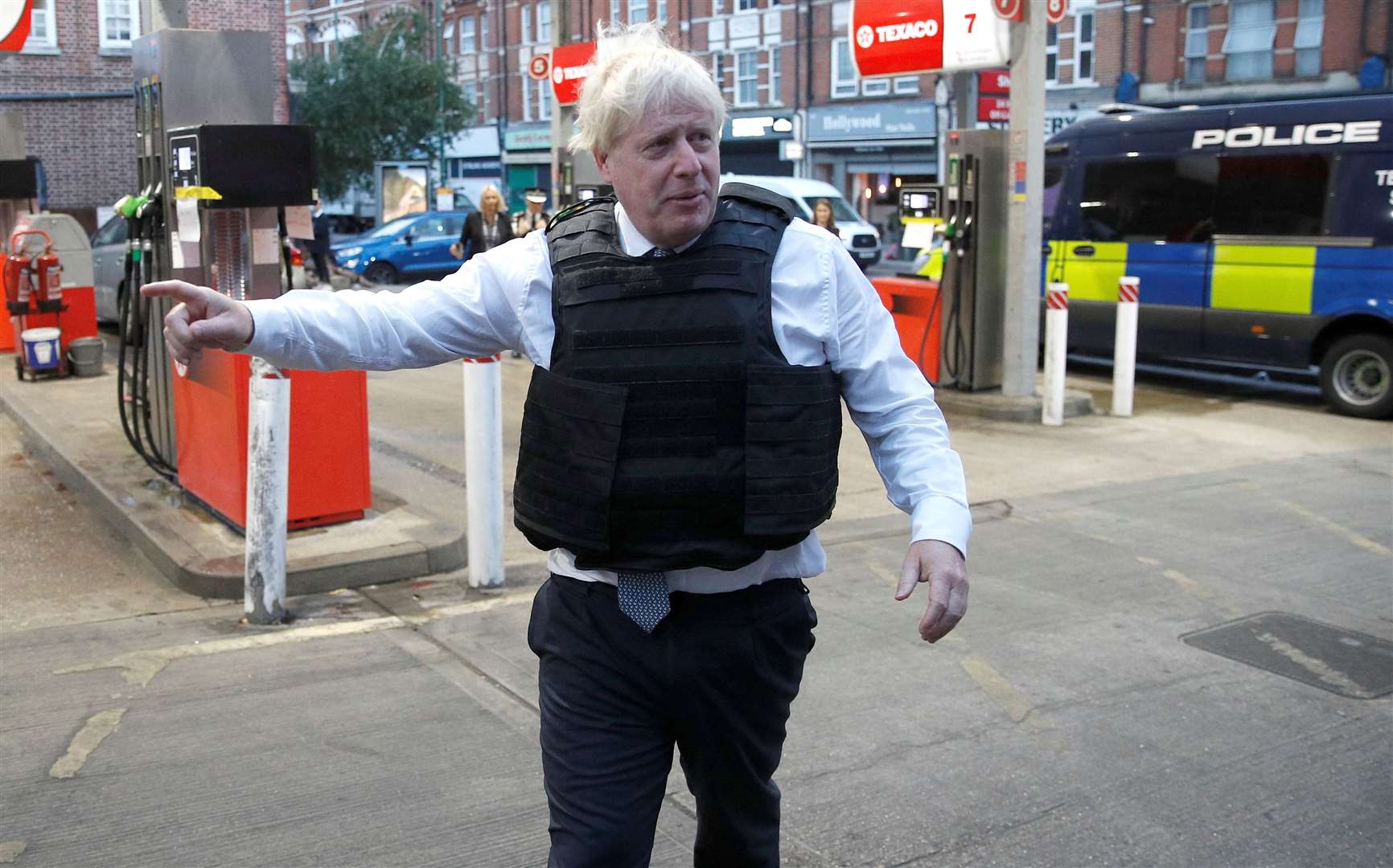 Mr Johnson leaves the area after viewing a drugs related raid by Metropolitan Police officers in West Norwood, London (Peter Nicholls/PA)