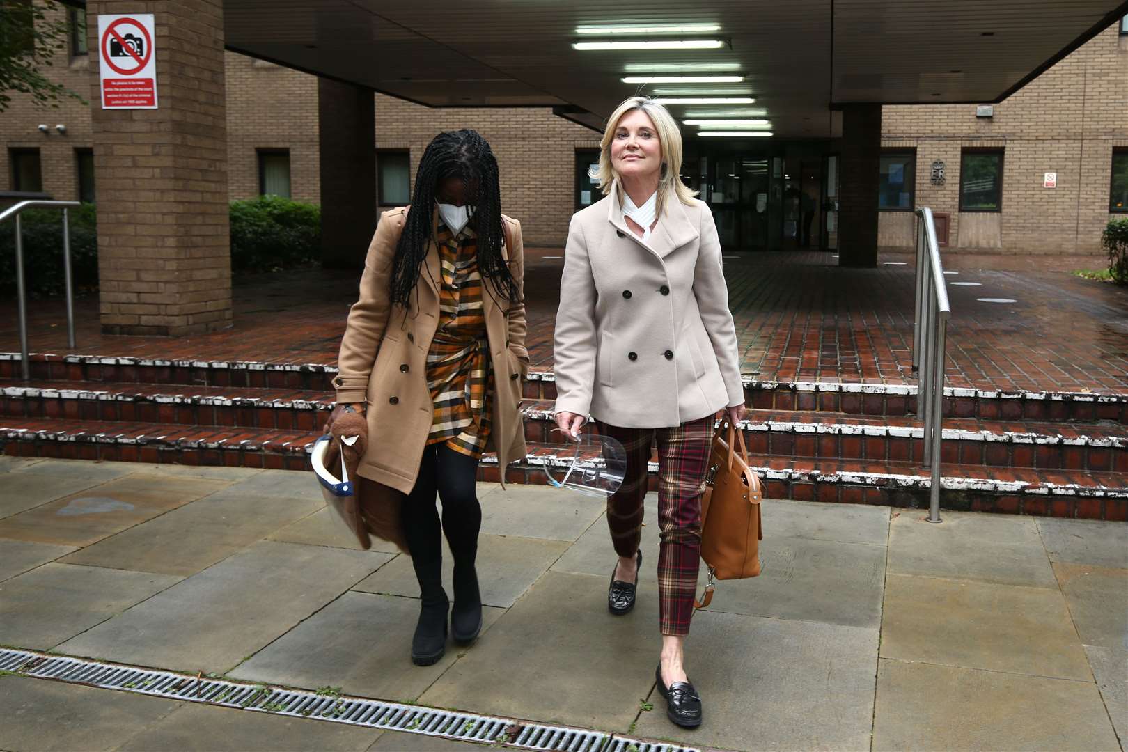 Diane-Louise Jordan and Anthea Turner leave Southwark Crown Court (Yui Mok/PA)
