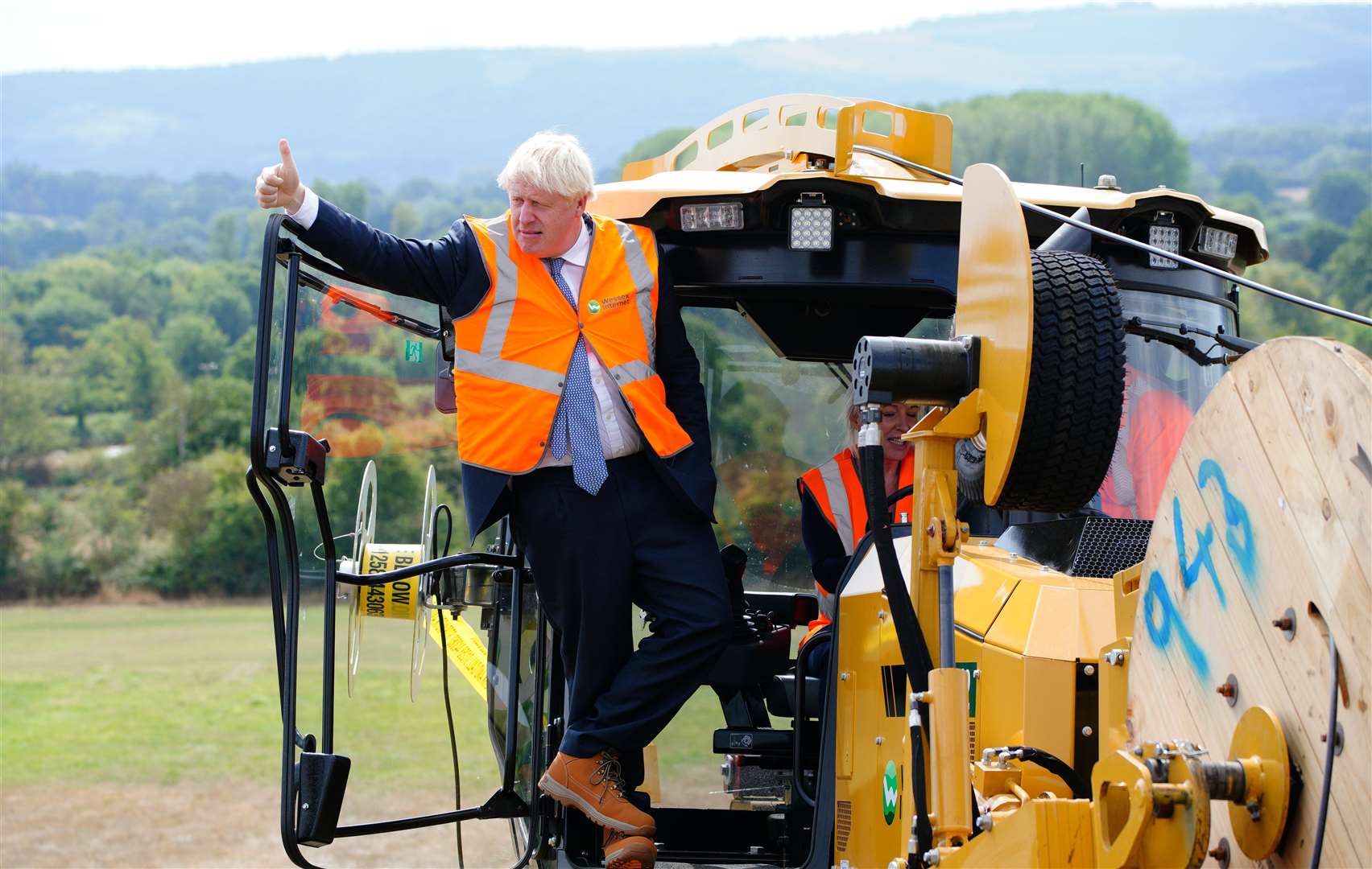 Prime Minister Boris Johnson during a visit to Henbury Farm in north Dorset, where Wessex Internet are laying fibre optics in the field (Ben Birchall/PA)