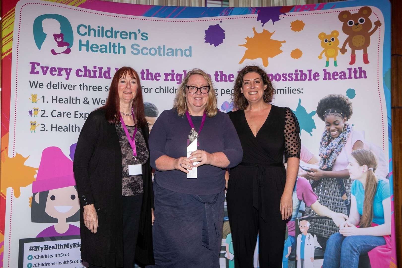 Laura Stewart is presented with her award by vice-chairwoman for Children’s Health Scotland Gwen Garner (left) and Scottish journalist and broadcaster Catriona Shearer who hosted the awards.