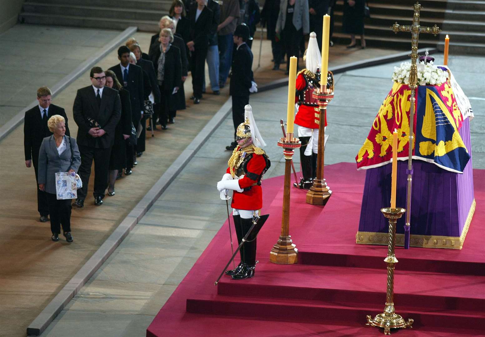 Mourners filing past the coffin of the Queen Mother (Phil Noble/PA)