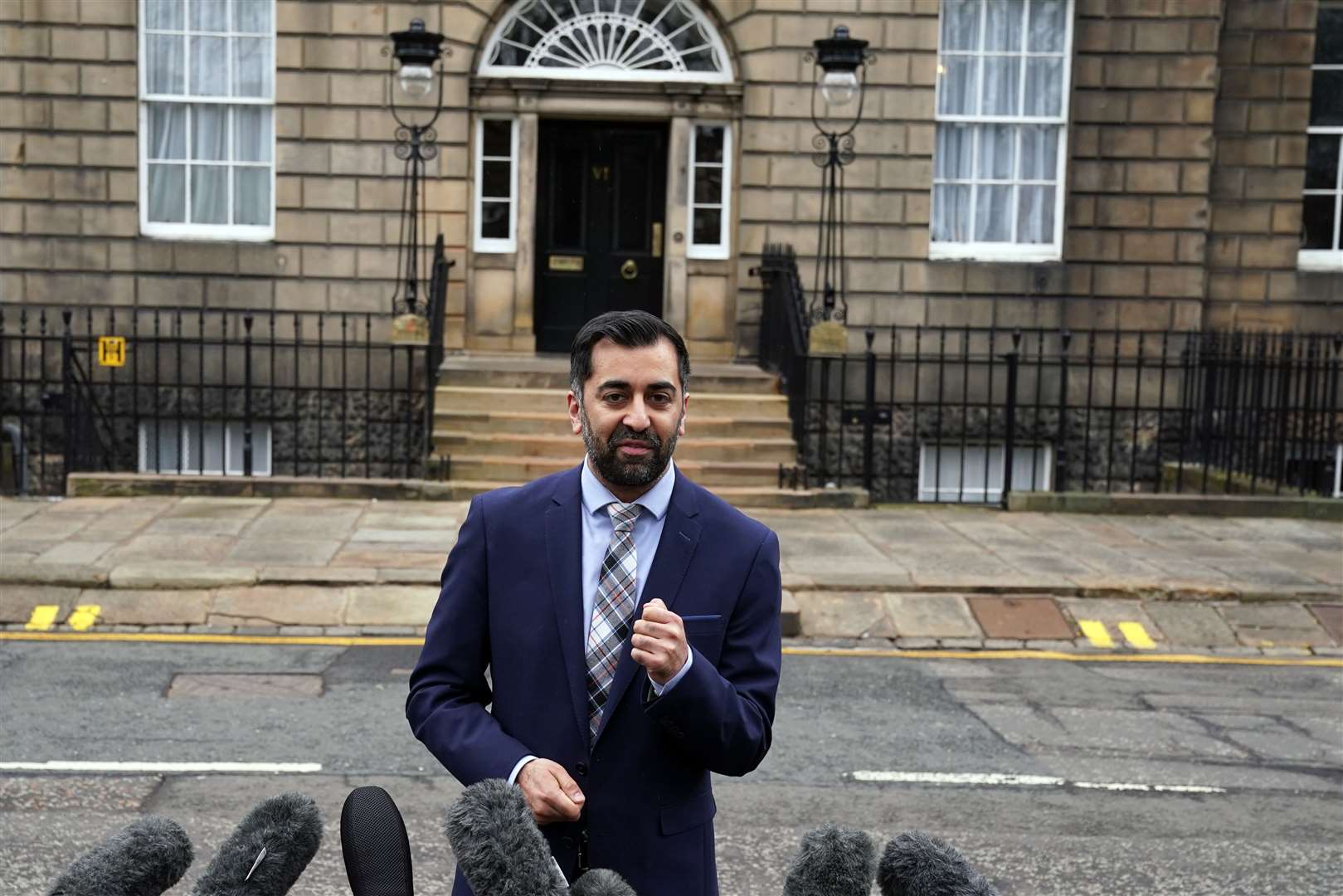 Newly elected First Minister of Scotland Humza Yousaf speaks to the media outside Bute House, Edinburgh, after holding his first Cabinet meeting (Andrew Milligan/PA)