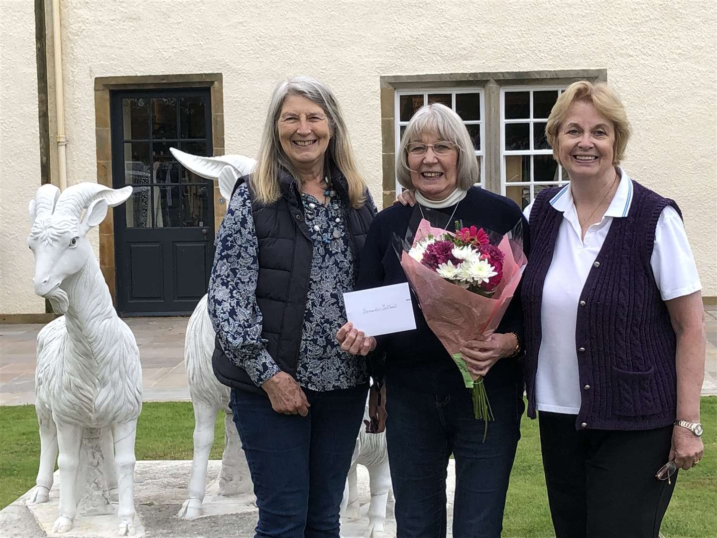 Philippa Buckingham and Kit Pawson of the Bennachie Barnado's Helpers group accepted a donation of £1500 from (centre) Izzie Macdonald.