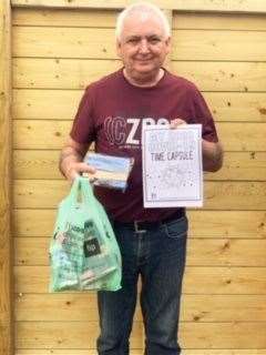 BDCC chairman Kevin Mckay with some one of the fun packs delivered to local children.