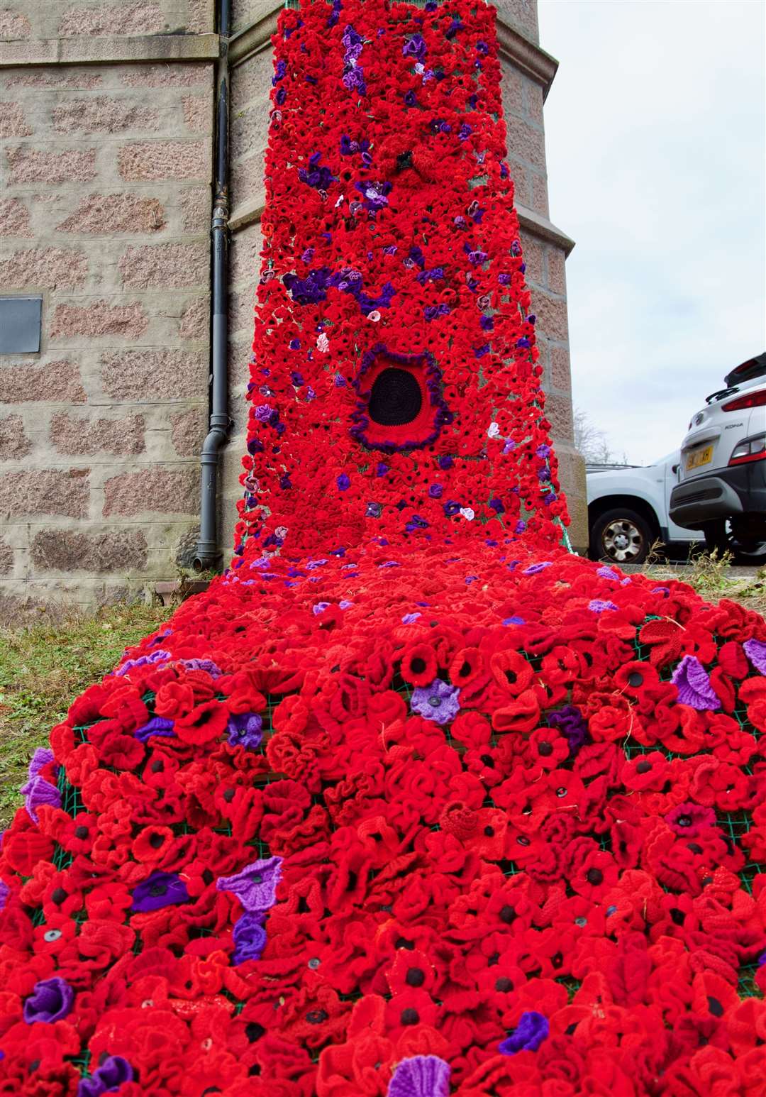 Legion members erected the long flowing cascade which knitted by members of the Knit and Natter group along with other helpers that knitted the woollen poppies.. Picture: Phil Harman