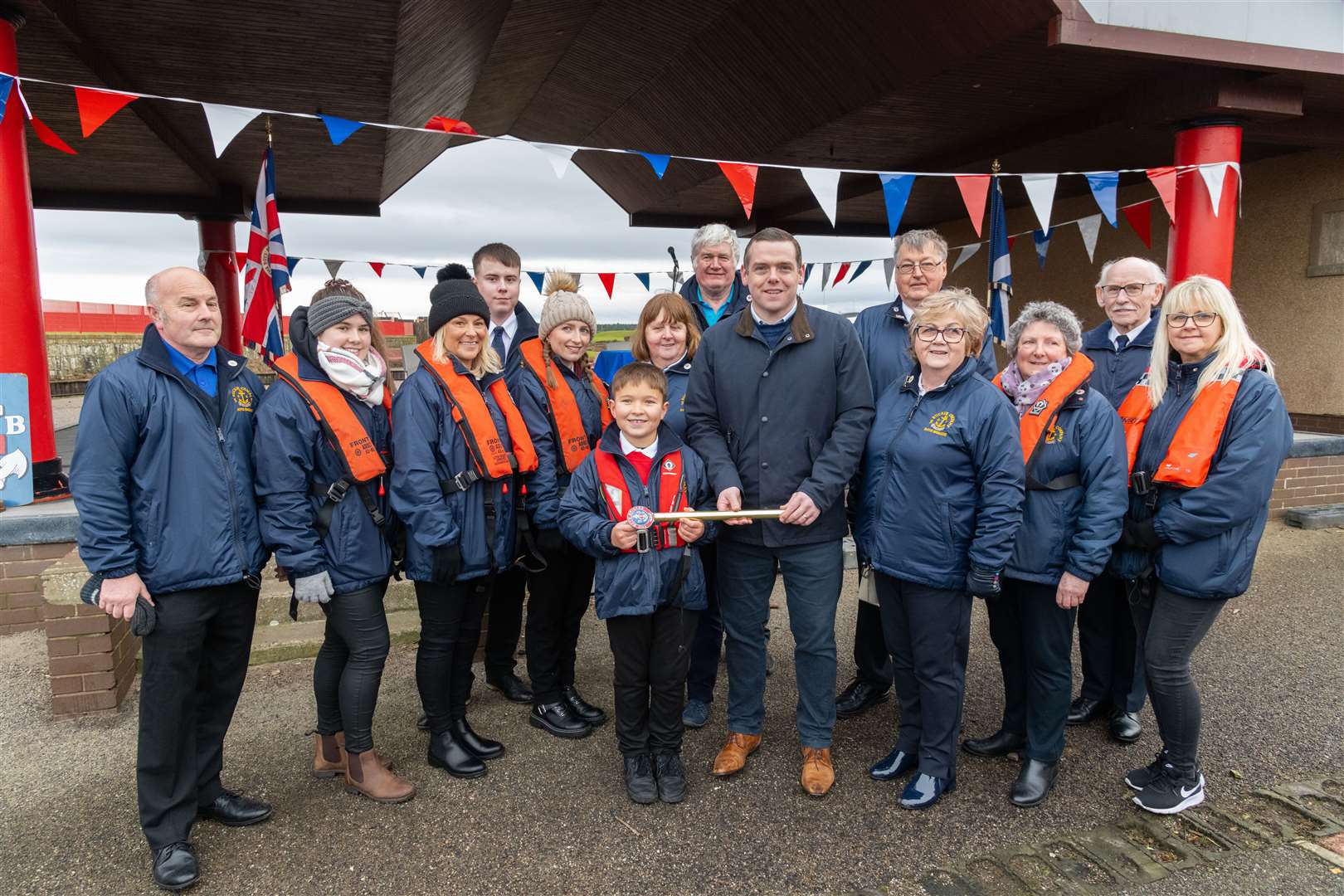 Douglas Ross MP (centre) with Mason Bennetts and members of 1st Buckie Company Boys' Brigade in Lossiemouth. Picture: Beth Taylor