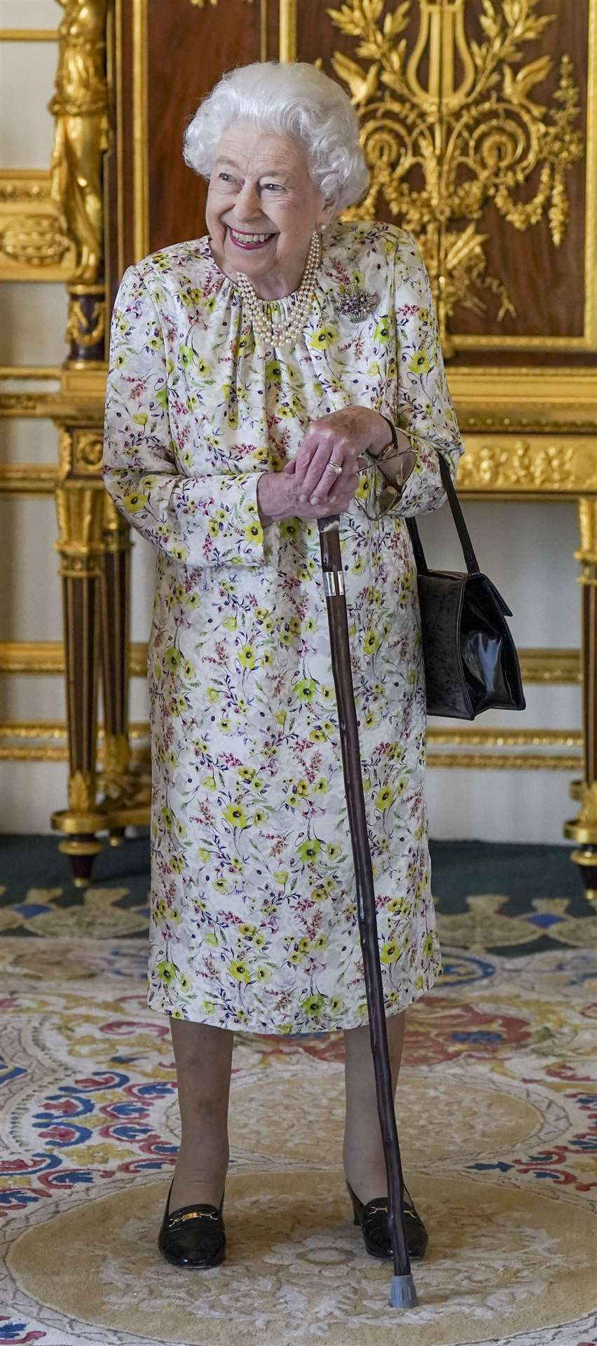 The Queen has taken to using a walking stick because of ongoing mobility difficulties (Steve Parsons/PA)